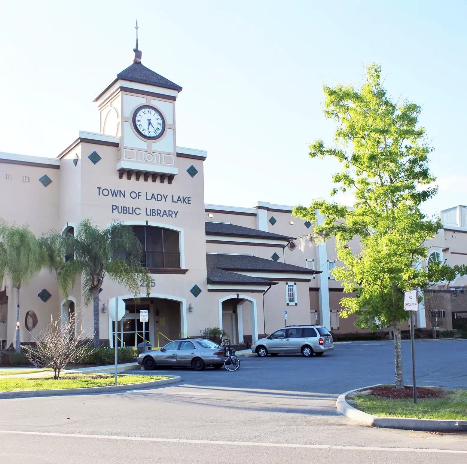 Red building with canopy over picnic tables