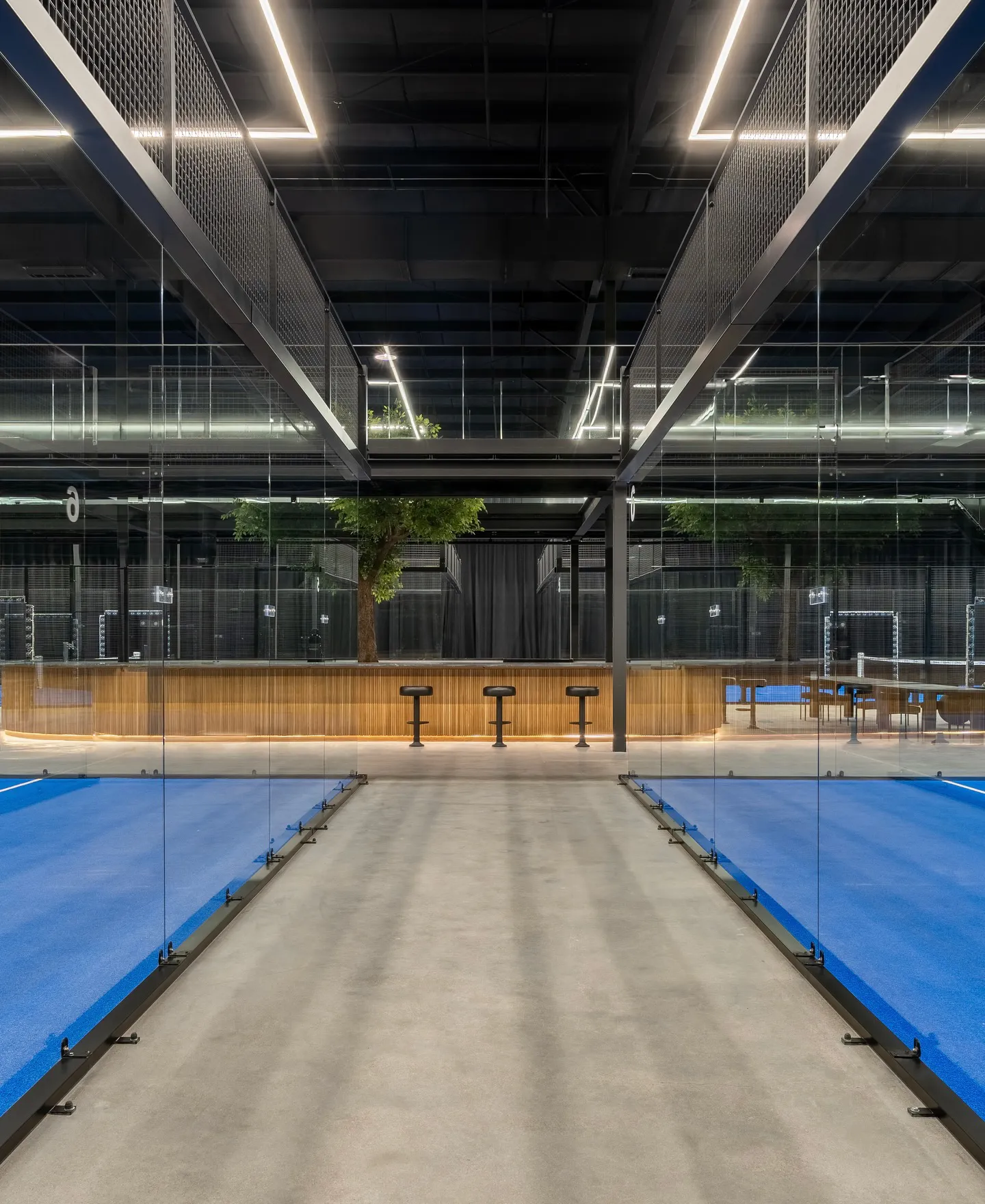 Red building with canopy over picnic tables
